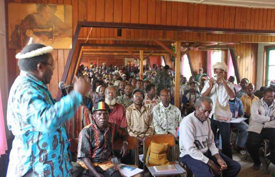 Neles Tebay leads a public consultation to build support for dialogue, in Enarotali , Papua, in 2010.