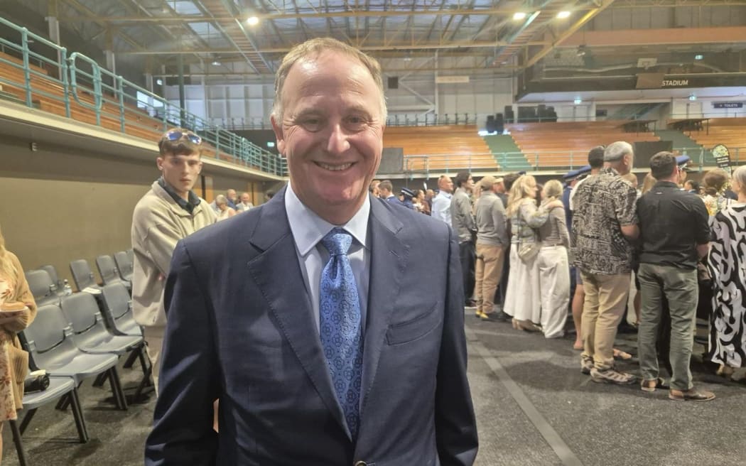 Former prime minister Sir John Key at a ceremony for the graduation of a police recruit wing in Auckland on 14 November 2025.