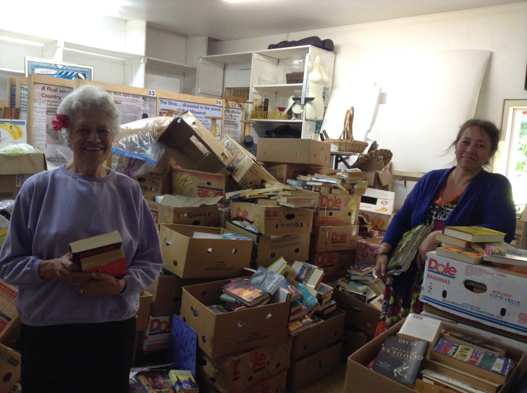 Jean Mason (right), the manager and curator of the Cook Islands Library and Museum Society, and librarian Sally Voss with donated books delivered recently by a Royal New Zealand Air Force C-130 Hercules aircraft.