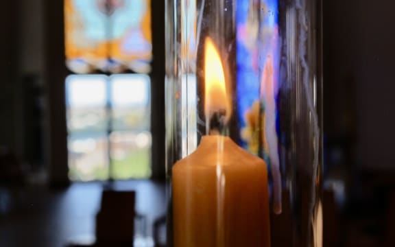 candle and stained glass