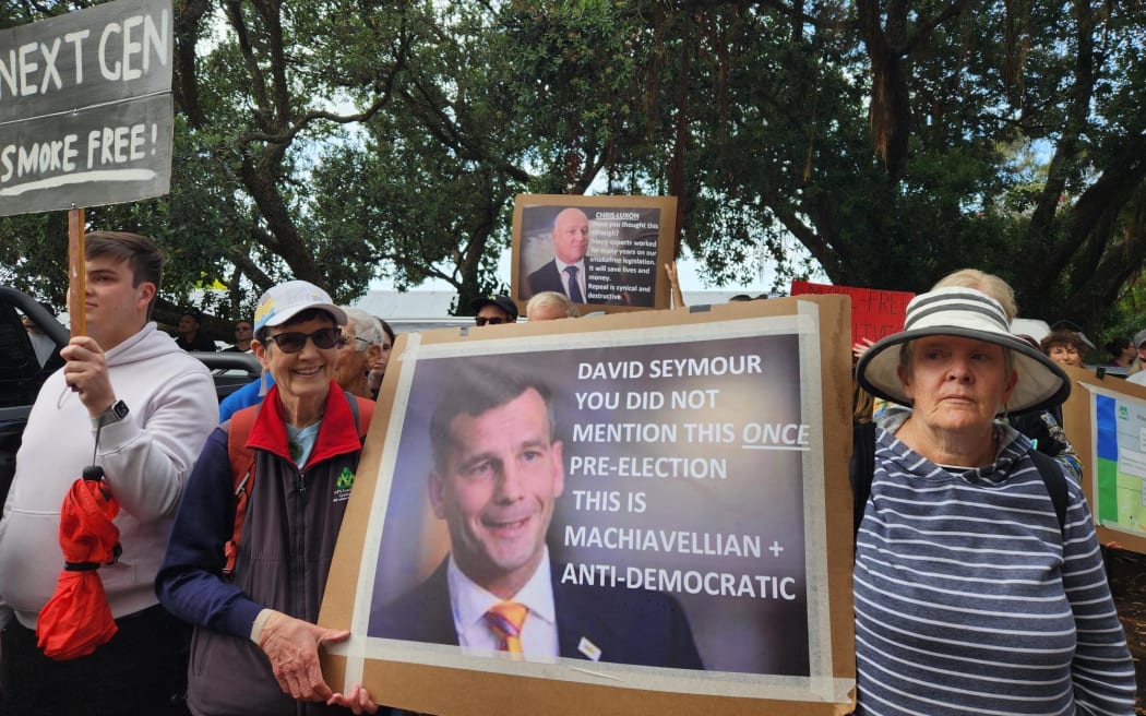 Protesters outside David Seymour's electorate office in Auckland.