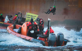 Greenpeace activists during a protest at a Shell platform, on the way to the North Sea, to expand an existing oil and gas field, off the coast of France on 6 February 2023.