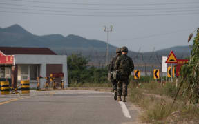 South Korean soldiers walk to a checkpoint at the Demilitarized zone (DMZ) separating North and South Korea, on Ganghwa island.