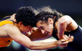Ana Moceyawa of New Zealand competes against Pooja Dhanda of India at the Women's Freestyle 57 kg Group match. Gold Coast 2018 Commonwealth Games, Wrestling, Gold Coast, Australia. 13 April 2018 © Copyright Photo: Anthony Au-Yeung / www.photosport.nz