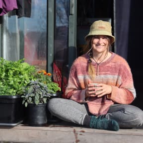 Kath Irvine on the porch of her house truck