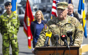 US Chairman of the Joint Chiefs of Staff, General Mark Milley speaks during a press conference, also attended by (L-R) Swedish Supreme Commander Micael Bydén, Swedish Prime Minister Magdalena Andersson and Swedish Defence Minister Peter Hultqvist, aboard the American amphibious warship USS Kearsarge in Stockholm, Sweden, on June 4, 2022, ahead of the Baltic Operations 'Baltops 22' exercise that will take place from June 5 to 17 in the Baltic Sea. (Photo by Fredrik PERSSON / TT NEWS AGENCY / AFP) / Sweden OUT