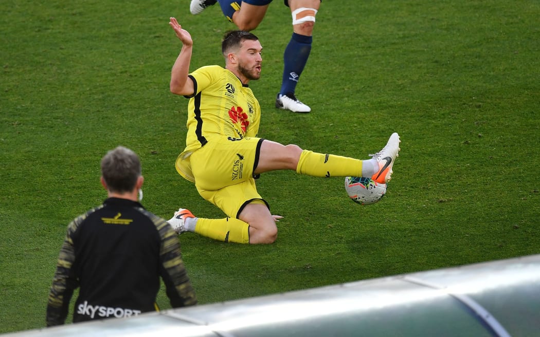 Phoenix's Tim Payne makes a pass during the A-League.