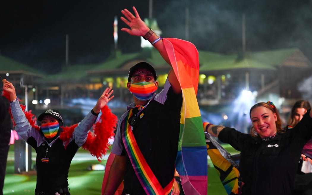 Police officers participate in the 44th Sydney Gay and Lesbian Mardi Gras Parade at the Sydney Cricket Ground (SCG) in Sydney on March 5, 2022. (Photo by Steven SAPHORE / AFP)