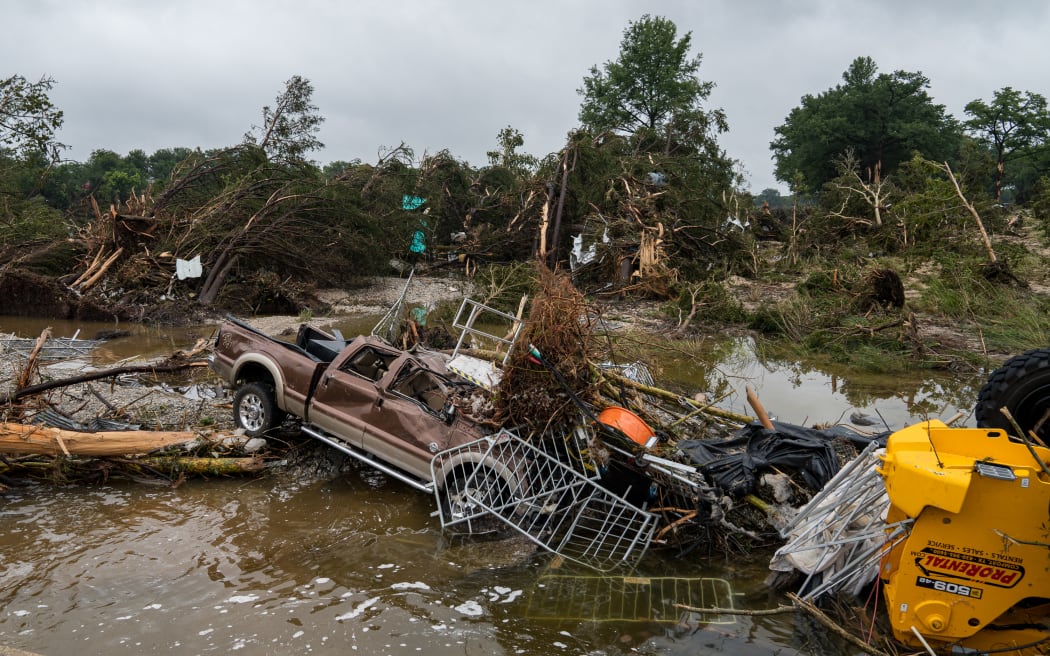 KERRVILLE, TEXAS - JULY 05: Flood waters left debris including vehicles and equipment scattered in Louise Hays Park on July 5, 2025 in Kerrville, Texas. Heavy rainfall caused flooding along the Guadalupe River in central Texas with multiple fatalities reported.   Eric Vryn/Getty Images/AFP (Photo by Eric Vryn / GETTY IMAGES NORTH AMERICA / Getty Images via AFP)