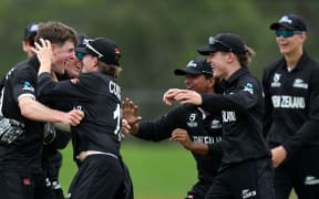 Matt Rowe of New Zealand celebrates the wicket of Numan Shah of Afghanistan.