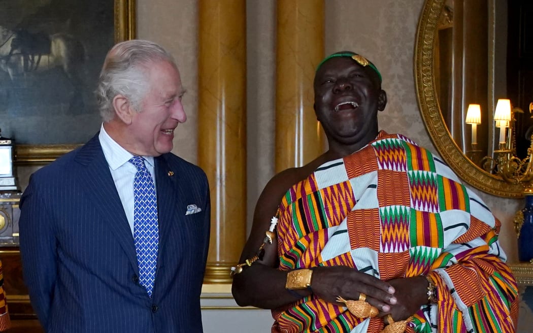 Britain's King Charles III (left) shares a joke with Ghanaian Ashanti King Otumfuo Osei Tutu II (R), during an audience at Buckingham Palace, central London, on 4 May, 2023.