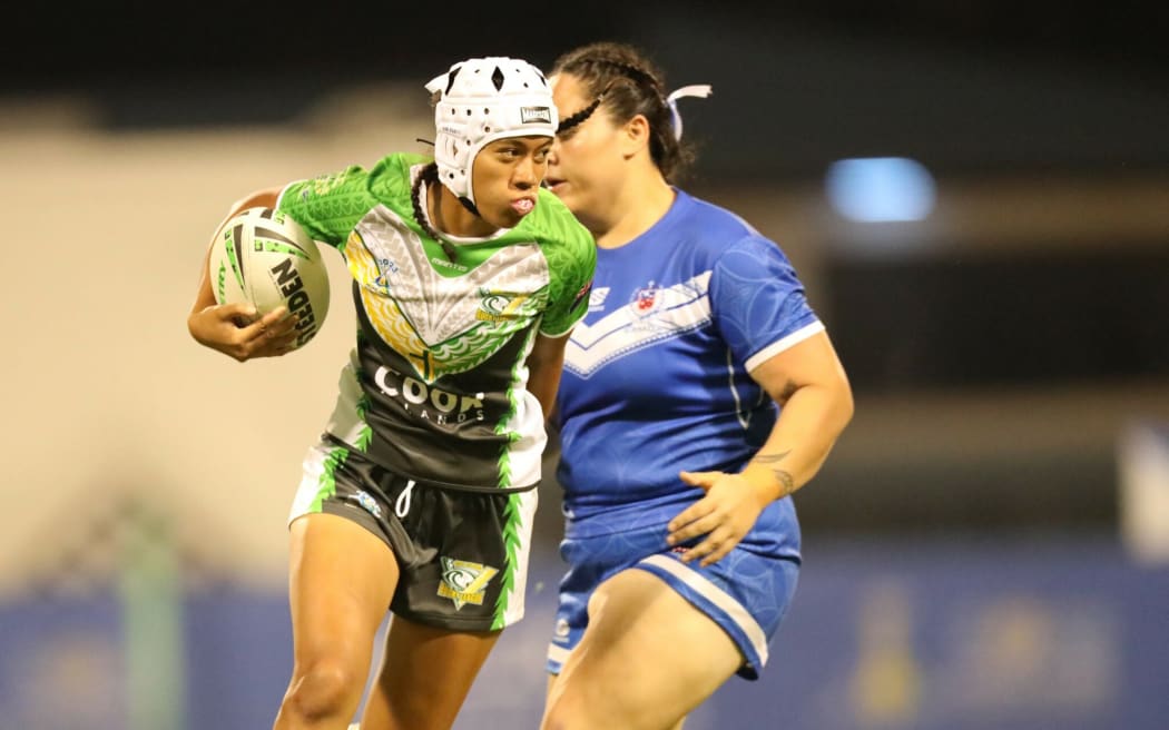 Cook Islands star Chantay Kiria-Ratu on the attack at the Games rugby league nines competition.
