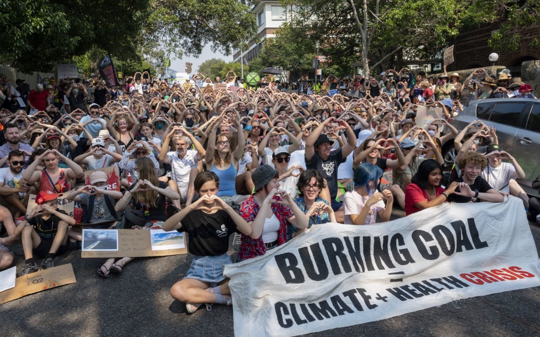 Demonstrators attend a climate protest in Sydney on December 19, 2019.