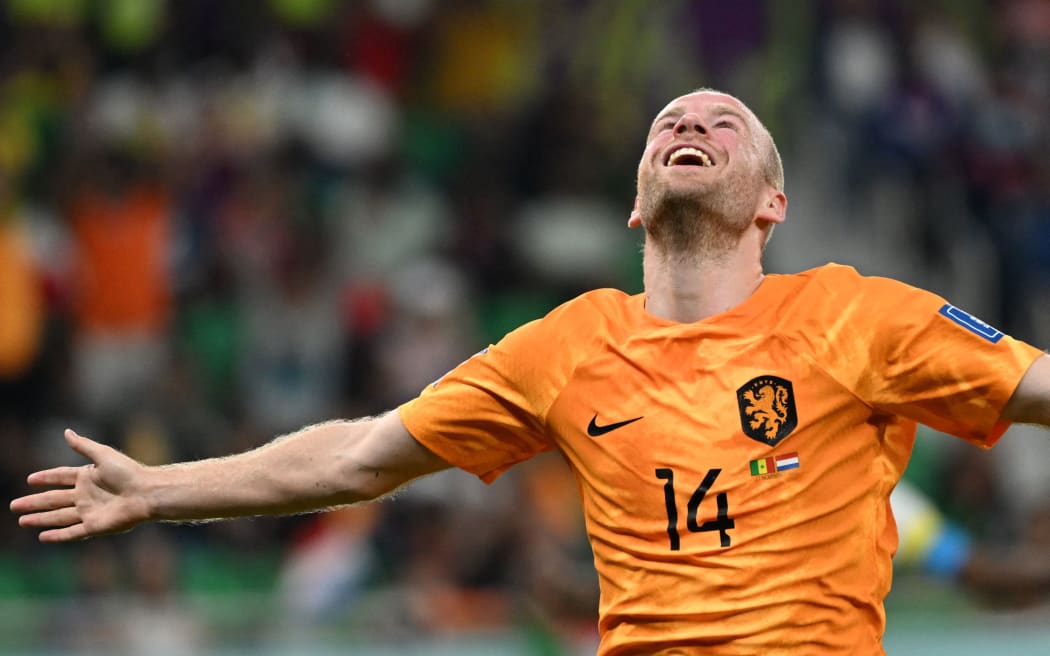 Netherlands' midfielder Davy Klaassen celebrates after he scored during the Qatar 2022 World Cup Group A football match against Senegal.