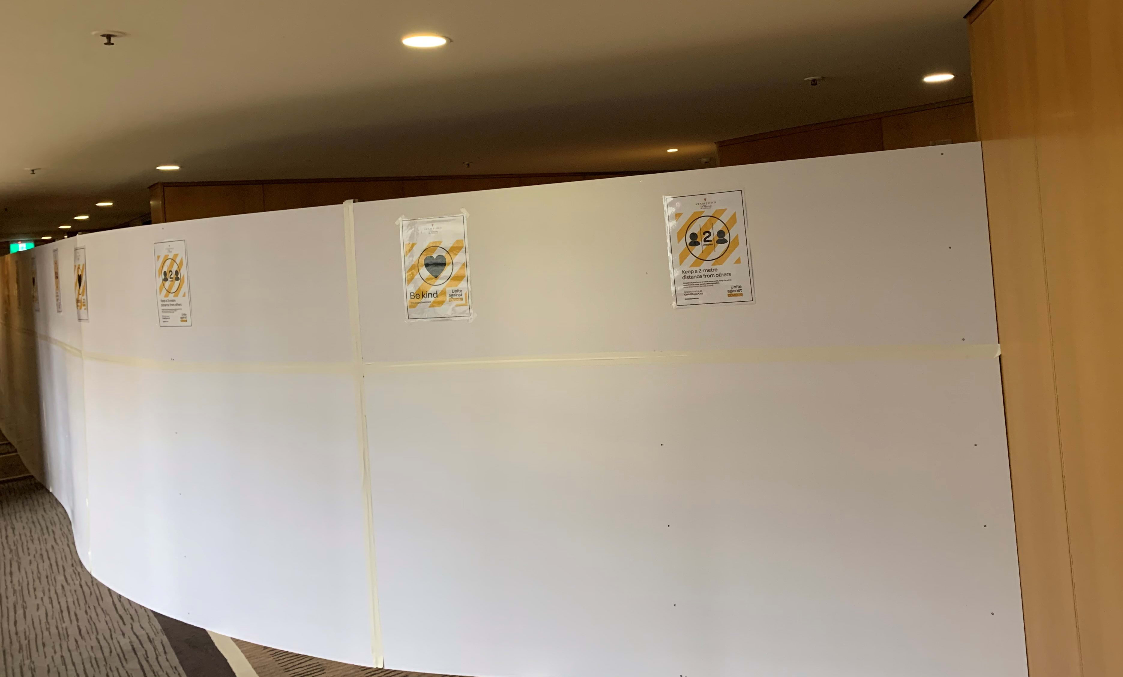 A divider has been installed at Stamford Plaza Hotel to separate those in managed isolation from residents in the building.