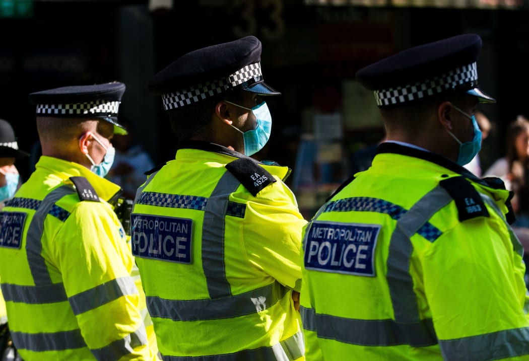 Police officers at an Extinction Rebellion protest in London, Britain, 23 August 2021. Climate action group Extinction Rebellion (XR) are planning to hold multiple actions over two weeks from August 23rd 2021