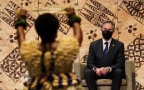 US Secretary of State Antony Blinken watches a cultural farewell ceremony during his visit to Nadi, Fiji on 12 February 2022.
