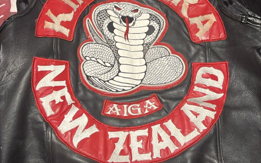 Several members of King Cobra have been accused of prohibiting the display of a gang crest.