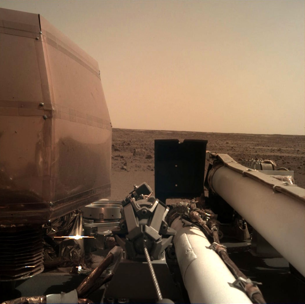 This imageshows a view from NASA's InSight lander after it touched down on the surface of Mars.