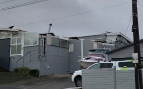 A roof of one home was severely damaged and had partially blown off.