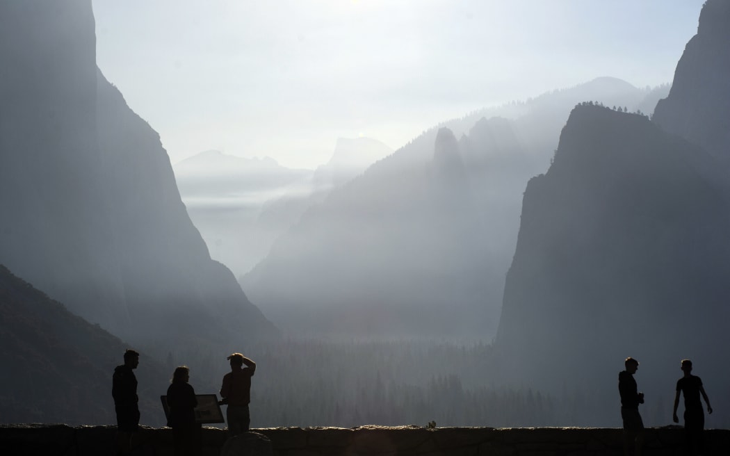 CALIFORNIA, UNITED STATES - JULY 14: Smoke from the Washburn Fire diffused the sunrise in the early morning at Yosemite National Park in California, United States on July 14, 2022. Neal Waters / Anadolu Agency (Photo by Neal Waters / ANADOLU AGENCY / Anadolu Agency via AFP)