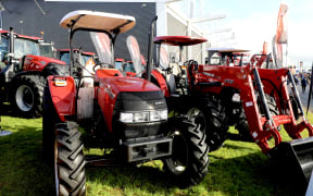 The government's tax reduction will make it appealing for farmers with older tractors to upgrade them, dairy farmers Christian Allen and Anna Maley say.