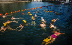 In Seine: Once seen as an open sewer that was too hazardous to swim in, the great river through Paris is now a popular summer bathing destination.