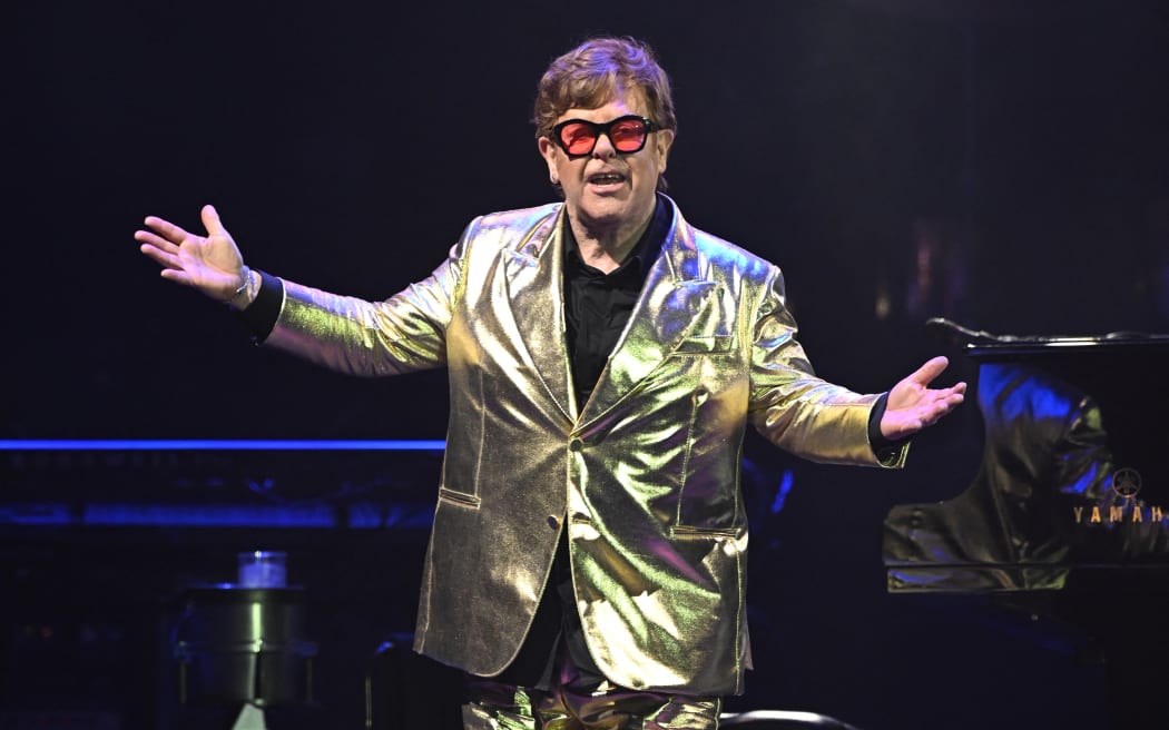British legendary singer Elton John performs on the Pyramid Stage on day 5 of the Glastonbury festival in the village of Pilton in Somerset, southwest England, on June 25, 2023. Elton John closes out Britain's legendary Glastonbury Festival on Sunday in what has been billed as his final UK performance. The 76-year-old pop superstar is winding down a glittering live career with a global farewell tour, having played his last concerts in the United States in May ahead of a final gig in Stockholm on July 8. (Photo by Oli SCARFF / AFP)