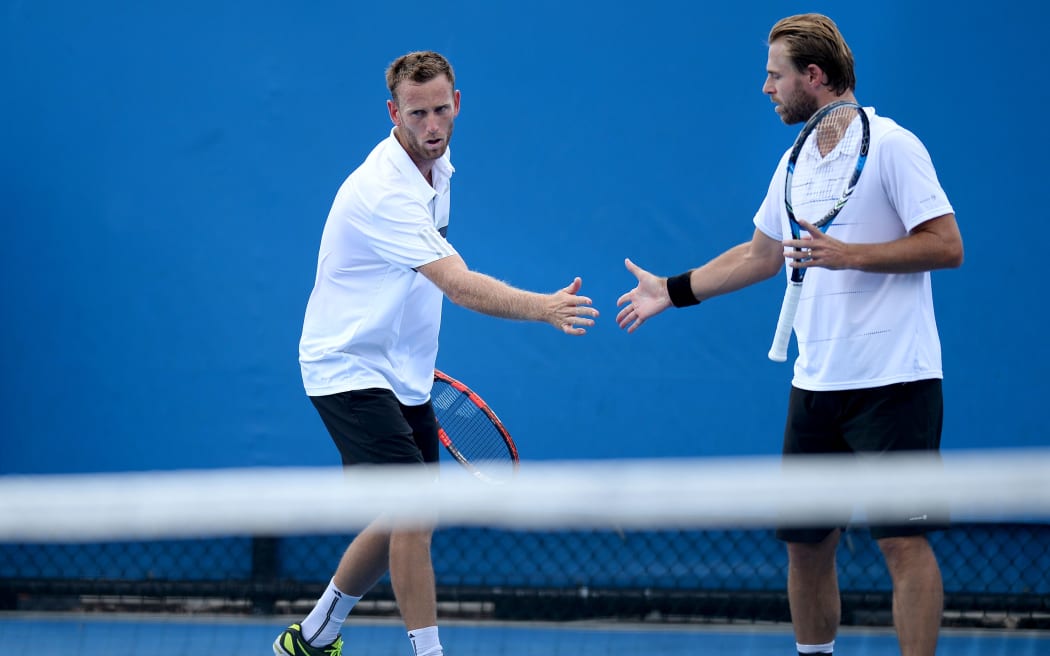 Michael Venus (left) celebrates a point with Oliver Marach