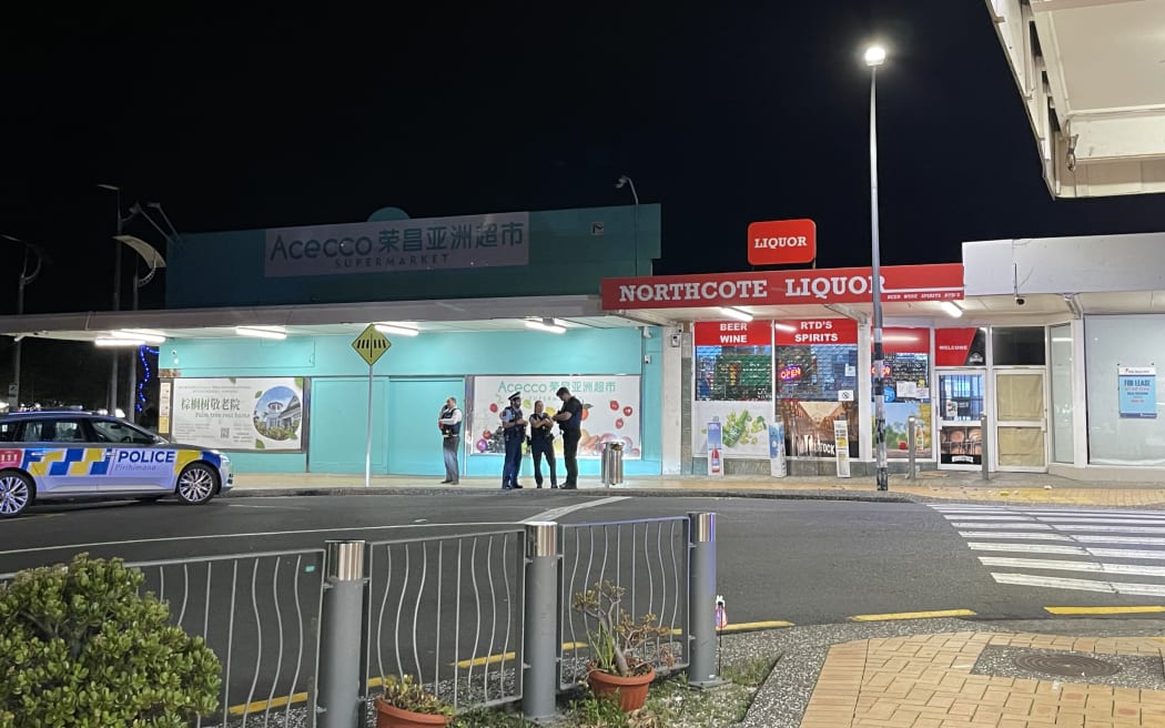 Police took at least one person into custody after responding to an incident at Northcote Liquor, Pearn Crescent, Auckland, on 25 May, 2025.