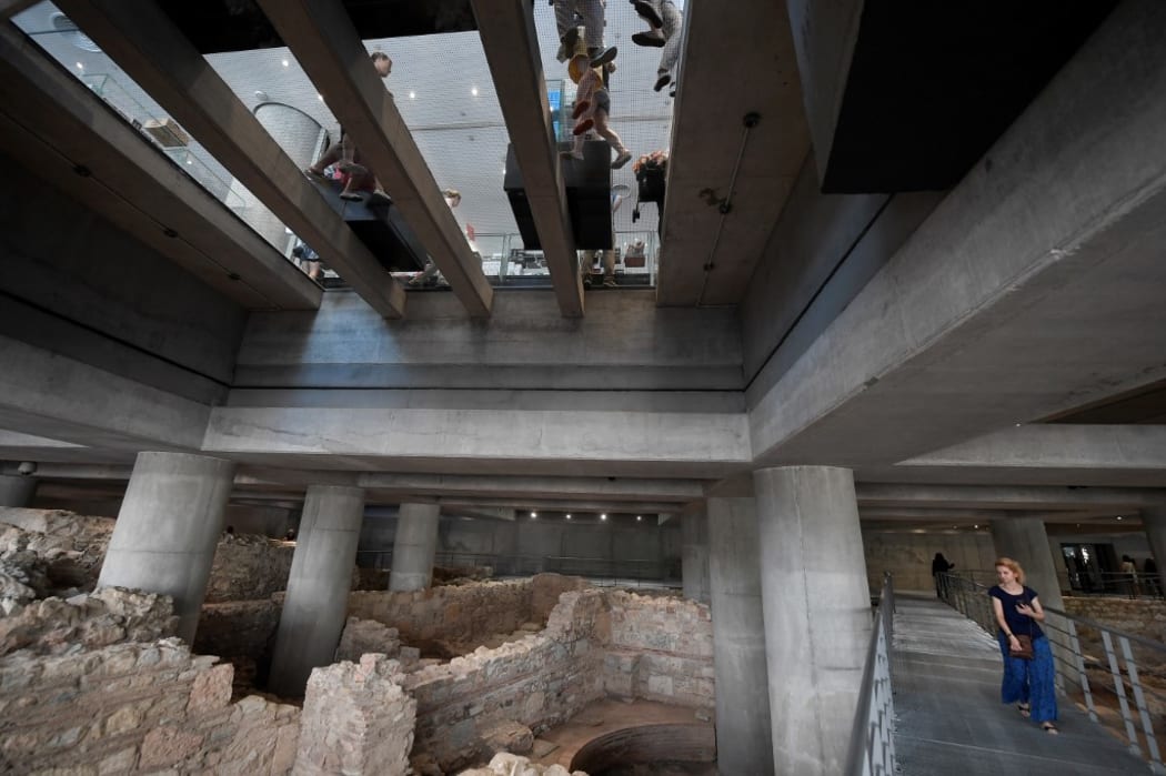People visit the excavation beneath the Acropolis museum in Athens, on its opening day on June 21, 2019 which coincidences with ten years of museum operation.