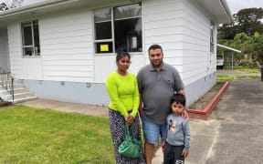 Razib Hussain (centre) with his wife Nusrat Jahan and son Rifayat. The family's Camphora Place house had been flooded and yellow-stickered twice in two years.