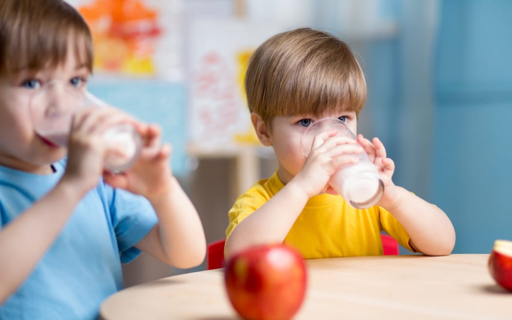 children eating healthy food at home or kindergarten
