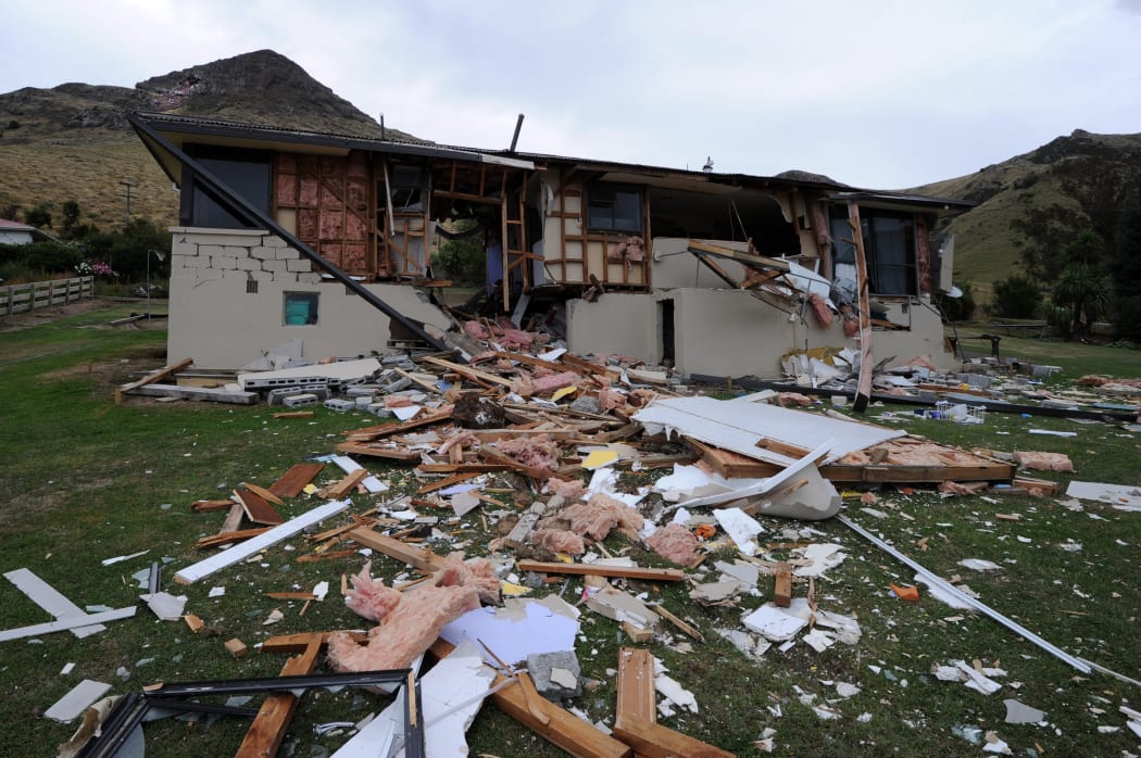 A house smashed in half by a boulder on the Port Hills in February 2011.