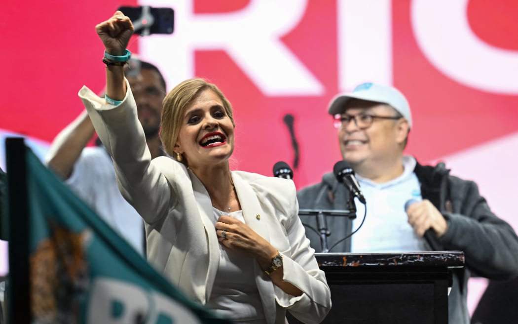 Costa Rica’s presidential candidate from the Sovereign People Party, Laura Fernandez, gestures to supporters after the presidential election results at the Aurola Hotel, in San Jose on February 1, 2026. Right-wing candidate Laura Fernandez won Costa Rica's presidential election on February 1 by a landslide after promising to crack down hard on rising violence linked to the cocaine trade. (Photo by MARVIN RECINOS / AFP)