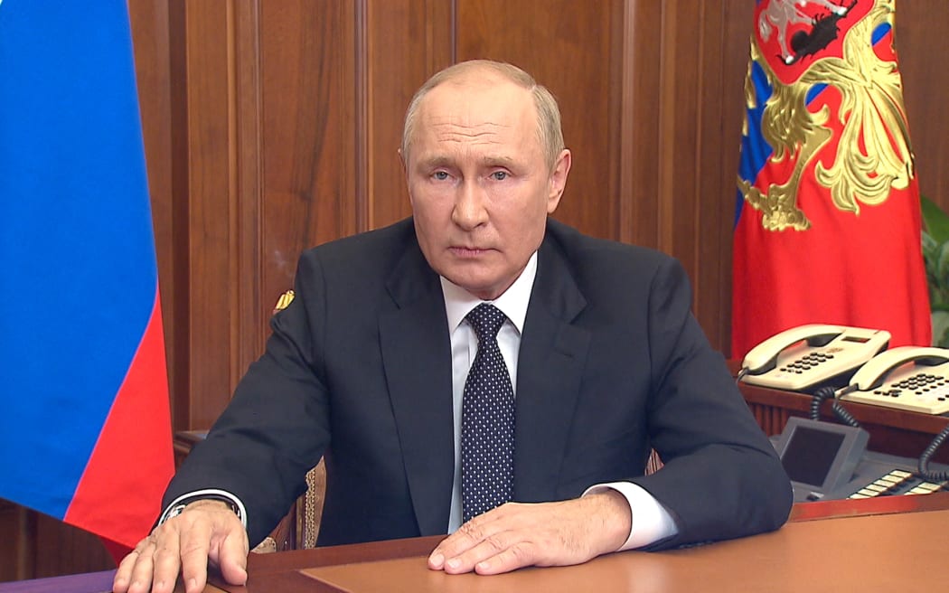 This handout picture released on September 21, 2022 by the Kremlin shows Russian President Vladimir Putin speaking during a televised address to the nation in Moscow. - President Vladimir Putin on Wednesday announced "partial" mobilisation in Russia, in an escalation of what Moscow calls its military operation in pro-Western Ukraine.