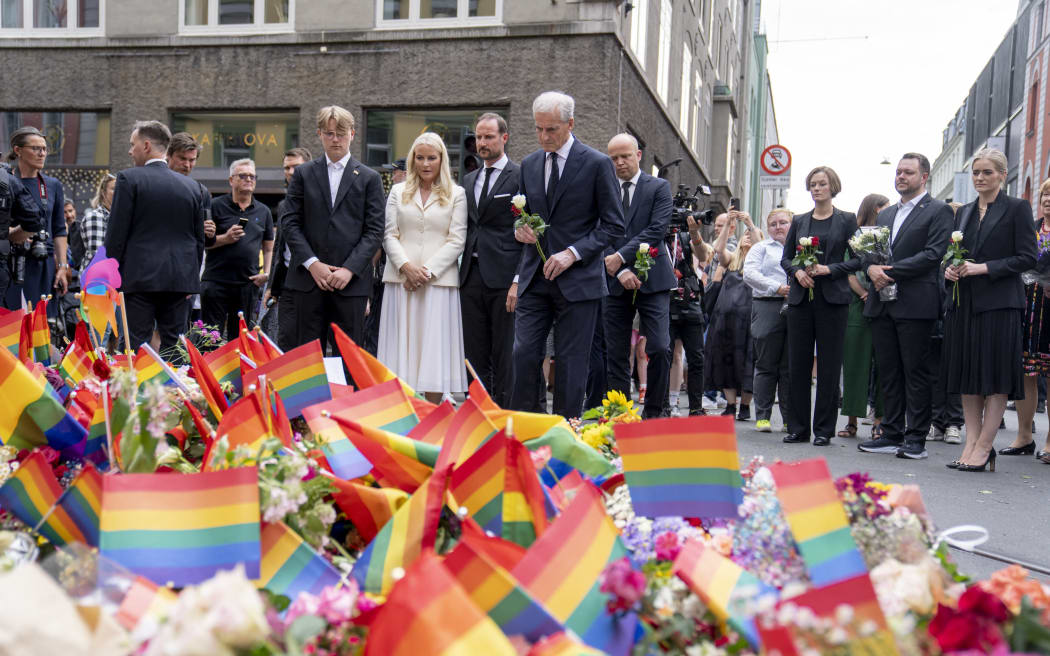Norway's Crown Prince Haakon, Crown Princess Mette-Marit and prime minister Jonas Gahr Store visit the scene of the shooting at the London Pub in Oslo, on 25 June, 2022.