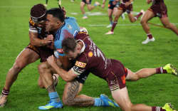 SYDNEY, AUSTRALIA - MAY 27: Tolutau Koula of the Blues is tackled by Kalyn Ponga of the Maroons during game one of the 2026 Men’s State of Origin series between New South Wales Blues and Queensland Maroons at Accor Stadium on May 27, 2026 in Sydney, Australia. (Photo by Darrian Traynor/Getty Images)