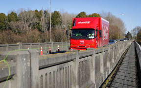 A truck passes over the Ashburton river bridge.