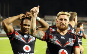 Sam Tomkins and Solomone Kata celebrate a Warriors win.