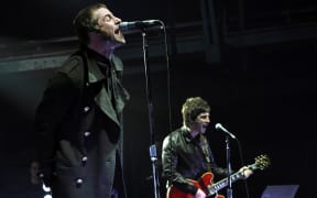 Liam and Noel Gallagher on stage in Munich, 2009.