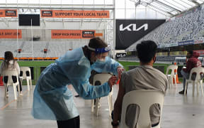 A person has a dose administered at the event.