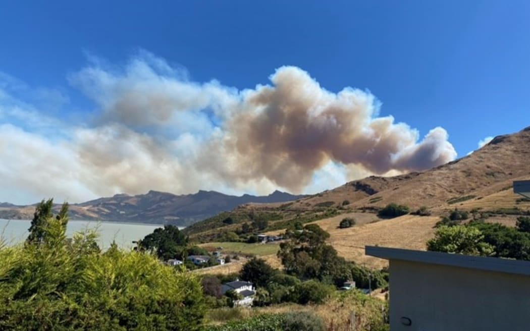 Smoke from the Port Hills fire as seen at Rāpaki Bay on 14 February 2024.