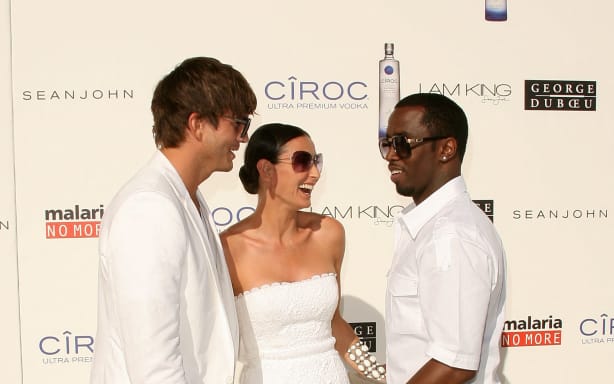 Actor Ashton Kutcher, actress Demi Moore and Sean “Diddy” Combs arrive at the White Party hosted by Diddy and Kutcher to help raise awareness for Malaria No More held at a Private Residence on July 4, 2009 in Beverly Hills, California.