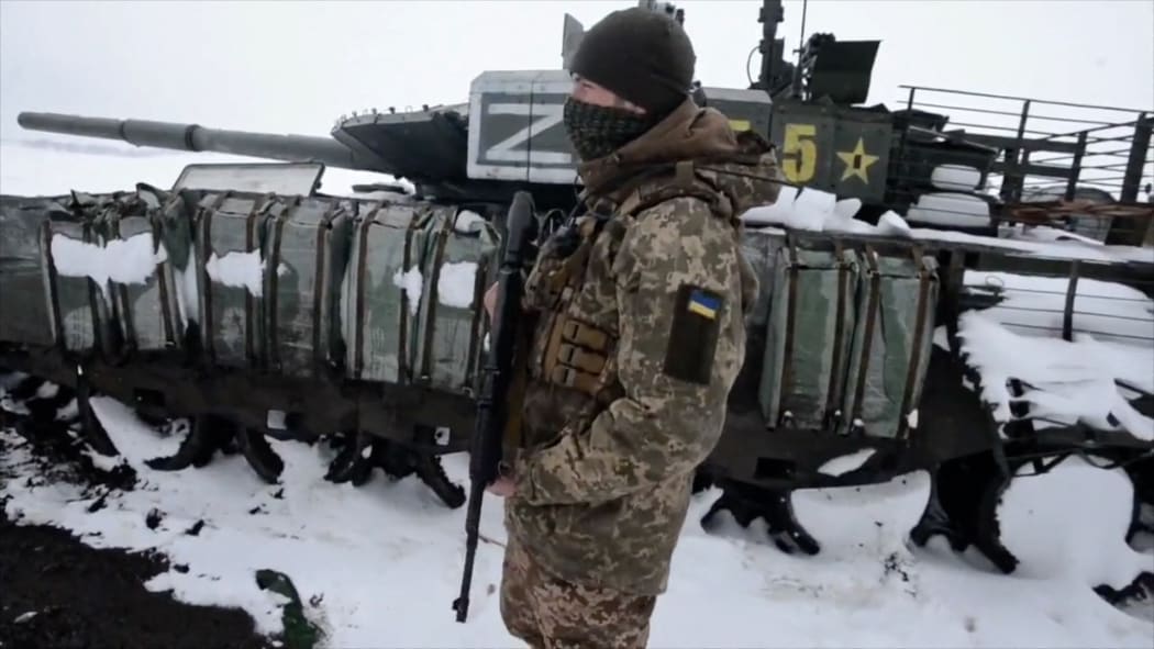 shows soldiers from the 93rd Kholodny Yar Brigade stand guard after they ambushed a Russian column in the north of Kharkiv region.