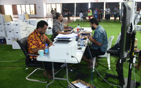 The Samoa Electoral Commission shows electoral officials monitoring the counting during the general election in the capital city of Apia.