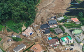 An aerial view shows a damage to a village following a landslide amid heavy rain in the village of Juksan-myeon, near Anseong on August 4, 2020. -