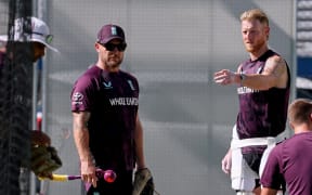 England's captain Ben Stokes, right, talks with head coach Brendon McCullum during a training session at The Gabba in Brisbane on December 2, 2025. (Photo by DAVID GRAY / AFP) / -- IMAGE RESTRICTED TO EDITORIAL USE - STRICTLY NO COMMERCIAL USE --