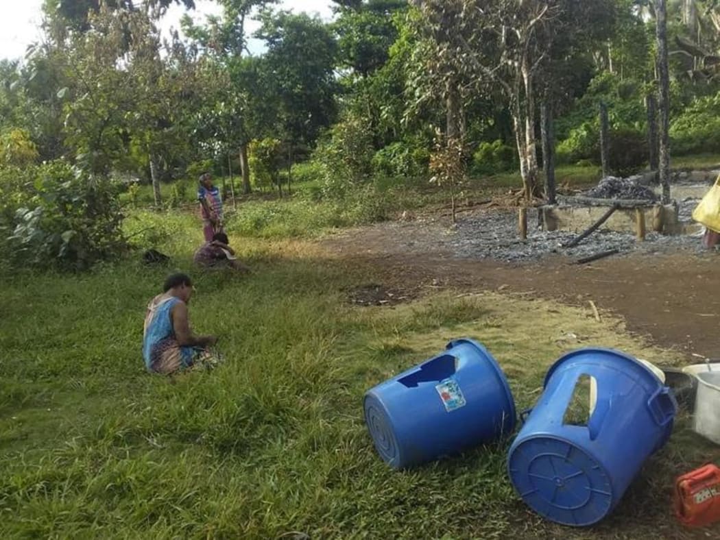 Villagers survey damage at Big Bay Bush in Santo