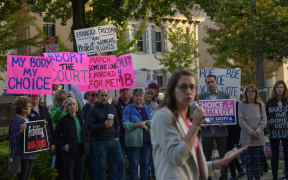 Lindsey Mauldin, Vice President of Advocacy and Public Policy at Planned Parenthood, speaks at a "Bans Off Our Bodies" abortion rights rally at Old Bucks County Courthouse in Doylestown, Pennsylvania on September 29, 2022. In Pennsylvania, the northeastern US state where a tight battle for a Senate seat is shaping up that could give Republicans a majority in the Senate, Democrats have clearly identified the stakes and their campaign sometimes takes on the appearance of a referendum to save abortion rights. With bans or restrictions on abortion rights in neighboring states, "patients are coming in from Ohio or West Virginia," Mauldin tells AFP, making "Pennsylvania a vital state for providing this care in the Northeast." (Photo by ANGELA WEISS / AFP)